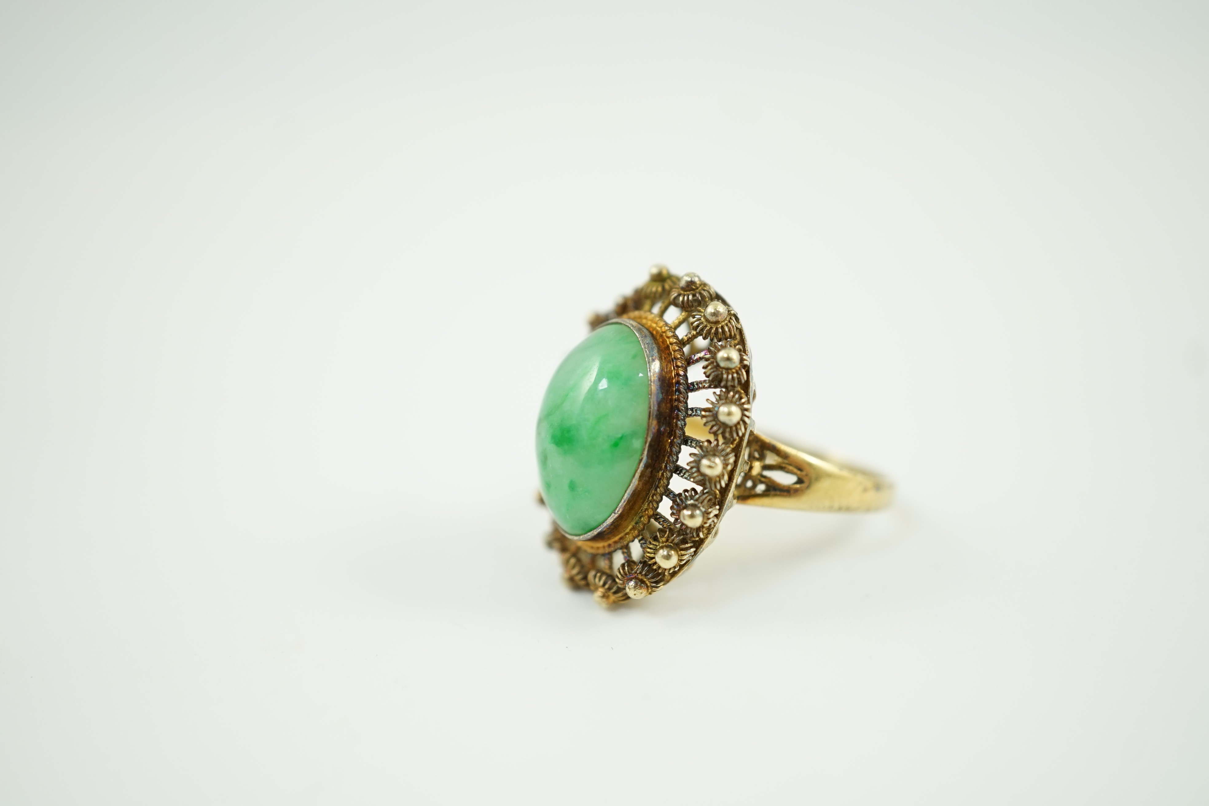 A Chinese? 14k yellow metal and cabochon jadeite set dress ring, size N, gross weight 6.3 grams.